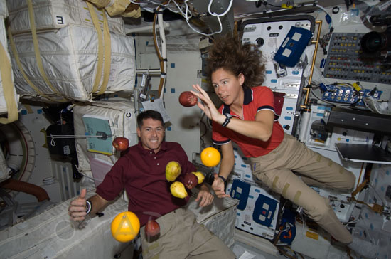 Astronauts in space shuttle