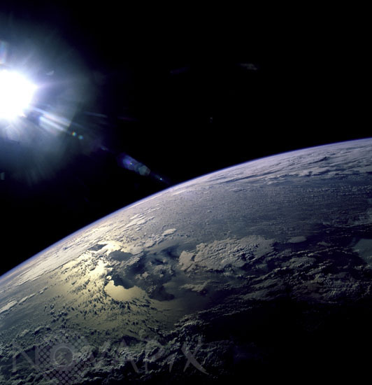 Earth and Sun as seen from space shuttle Discovery 02/1997