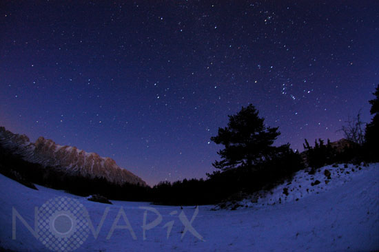 Winter starry night in the Alps