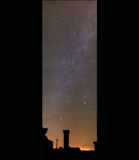 Starry sky above ruins of an old chapel